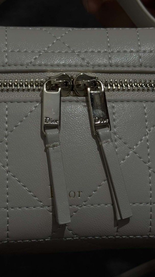 Dior Travel Vanity Case White Cannage (Category: Luxury Bags & Wallets) located in Cavite. Submitted by loriojenni09117 (Listing ID 1469711643, Image 3). Description: - Dior vanity bag in clean white leather - Classic cannage stitching with elegant gold-tone hardware and Dior logo zippers - Structured shape with a convenient top handle - Versatile: includes both a chic chain strap and an adjustable leather shoulder strap - Stamped 'Dior Made in I