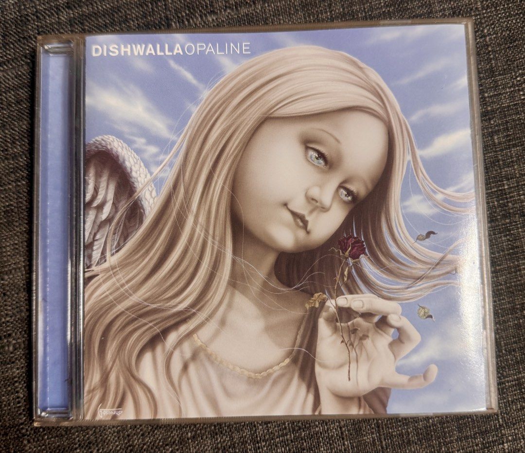 Dishwalla Opaline CD US press (Category: CDs & DVDs) located in Pasig City. Submitted by proteinboy6 (Listing ID 1469612990, Image 1). Description: US press Good as New, crystal clear, pages are wrinkle free and spotless. A Rare gem. - Original Dishwalla Opaline audio CD - Complete with jewel case, artwork booklet (with lyrics and band photos), and back tray insert - Includes popular tracks like Home, When Morning Comes, Mad Life, and Angels or D
