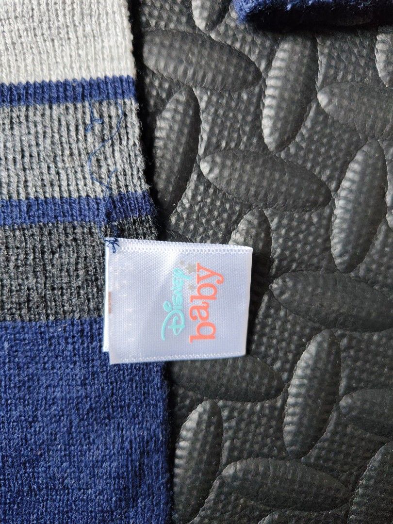 Disney Baby Scarf & Knit Cap (Category: Bedding & Towels) located in Quezon City. Submitted by zs.onlinehub (Listing ID 1469616033, Image 3). Description: - Authentic Disney Baby striped knit blanket - Color: Blue, grey, and white - Soft and lightweight fabric - Ideal for stroller use or the nursery - Features a securely stitched Disney Baby tag - Perfect for gifting or everyday use P.S. mas darker color sa personal.