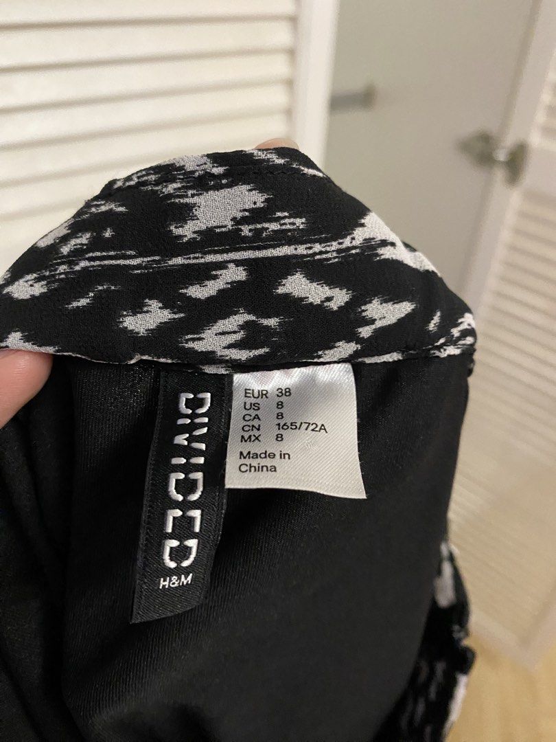 Divided by H&M Black and White Patterned Maxi Skirt (Category: Skirts) located in Quezon City. Submitted by chloe.max (Listing ID 1469641175, Image 3). Description: - Brand: Divided by H&M - Size: US 8 / EUR 38 - Pattern: Black and white geometric tribal print - Fabric: Lightweight with a flowy drape - Style: Minimalist boho vibe, great with boots or sandals.
