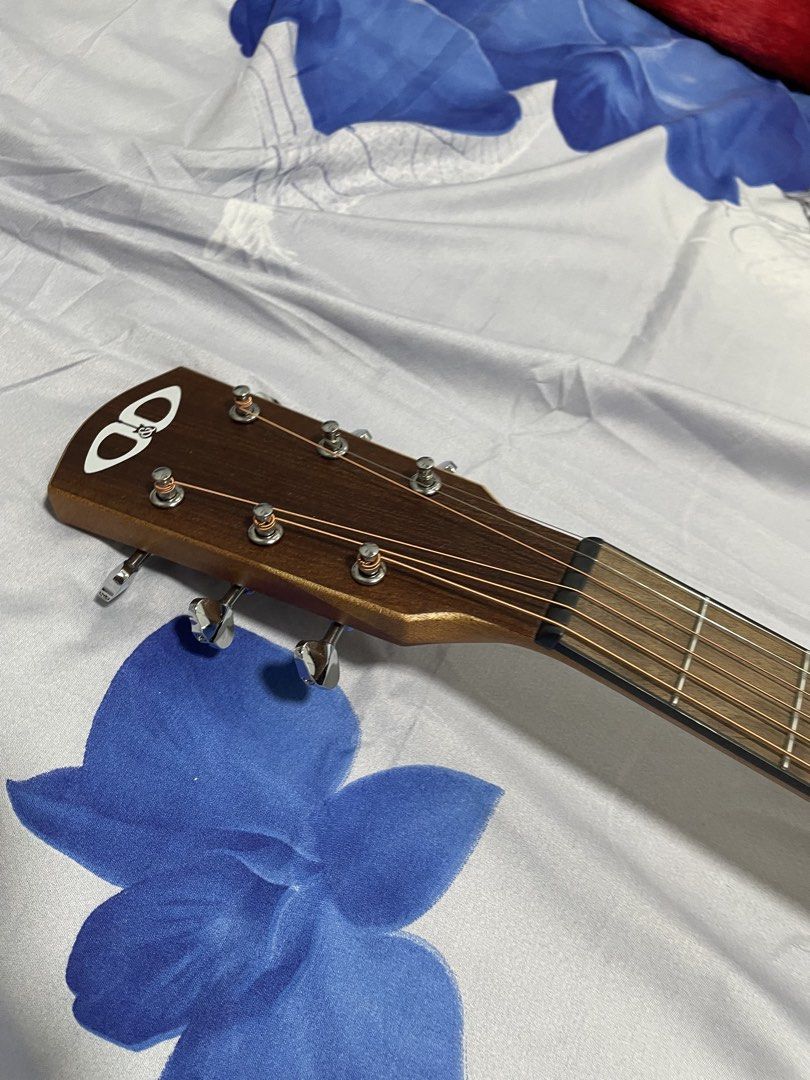 Django Guitar LE (Category: Musical Instruments) located in Manila. Submitted by jhonmarvin33311 (Listing ID 1469580427, Image 3). Description: Selling my Django LE Guitar. Only used casually for about a month when I was learning guitar, so it’s still lightly used and in good condition. Inclusions: * Thickly padded guitar bag * Capo * Guitar picks * Neck adjuster * Extra set of guitar strings The guitar also has a built-in tuner and AUX connectio
