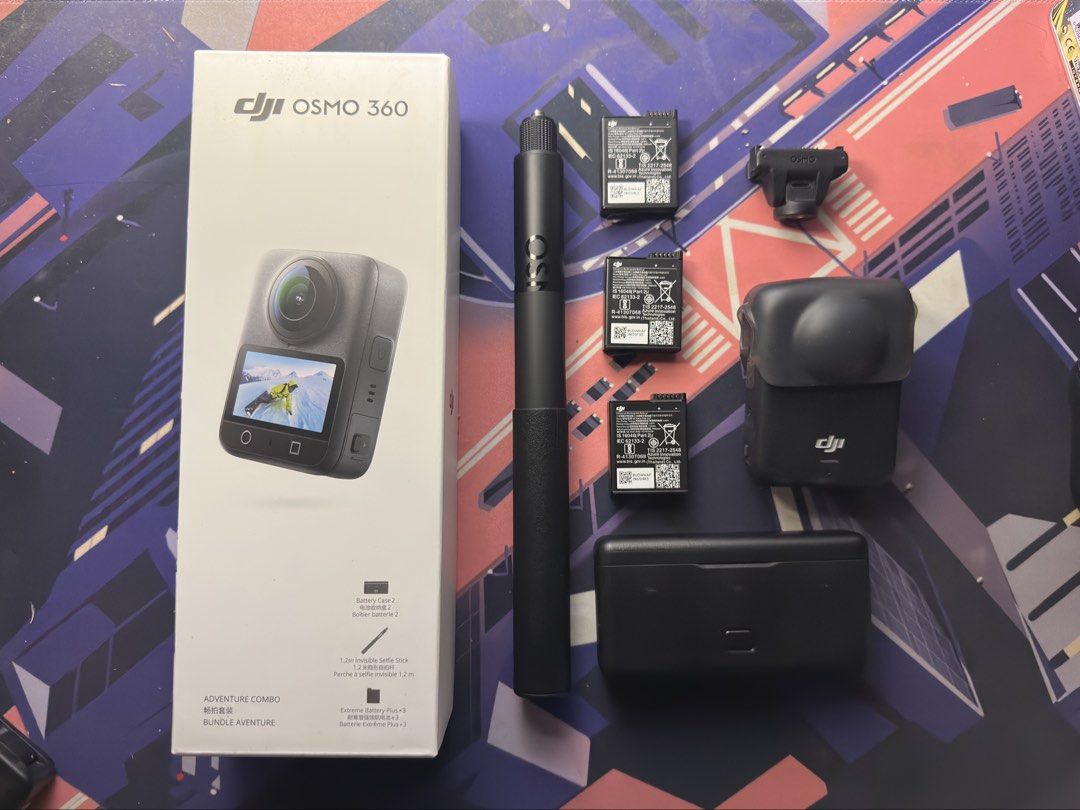DJI Osmo 360 Adventure Combo (Category: Video Cameras) located in Pasig City. Submitted by enemen.ten (Listing ID 1469725629, Image 1). Description: - Authentic DJI Osmo 360 Adventure Combo with original box - With warranty - Used, like new - With minor scratches - Includes 1.2m invisible selfie stick for seamless shots - Powered by 3 extreme batteries with a convenient charging case - Comes with protective cover and mounting bracket - Ideal for 
