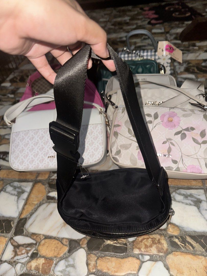 DKNY Black Nylon Belt Bag (Category: Luxury Bags & Wallets) located in Bugallon. Submitted by lavenderlane (Listing ID 1469669270, Image 3). Description: - Brand: DKNY - Material: Durable black nylon with silver-tone hardware - Storage: Main compartment with branded lining and front zip pocket - Fit: Adjustable webbed strap with secure buckle closure - Use: Lightweight design, ideal for daily use or travel.