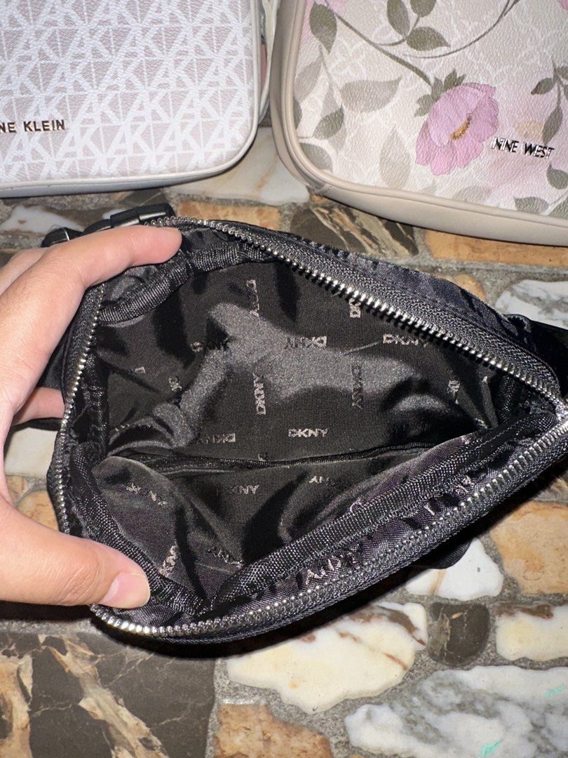 DKNY Black Nylon Belt Bag (Category: Luxury Bags & Wallets) located in Bugallon. Submitted by lavenderlane (Listing ID 1469669270, Image 2). Description: - Brand: DKNY - Material: Durable black nylon with silver-tone hardware - Storage: Main compartment with branded lining and front zip pocket - Fit: Adjustable webbed strap with secure buckle closure - Use: Lightweight design, ideal for daily use or travel.
