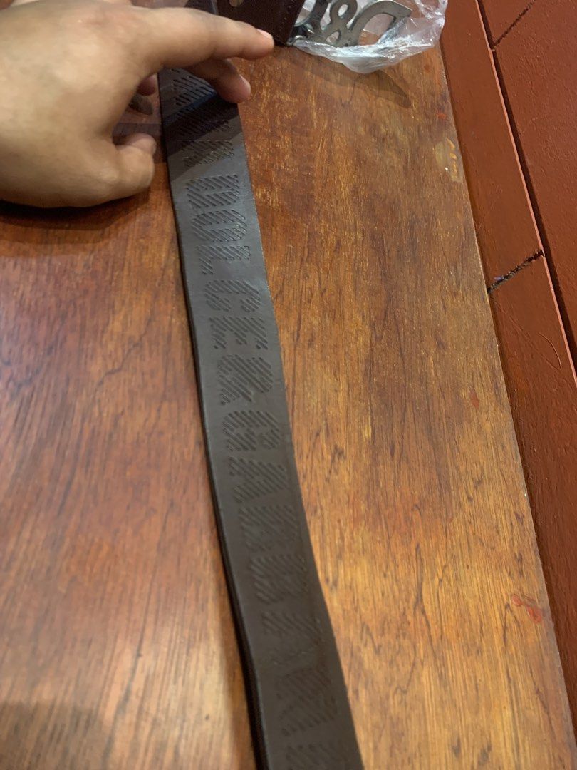 Dolce & Gabbana D&G Brown Leather Belt (Category: Belts) located in Cagayan de Oro. Submitted by agboysalis60090 (Listing ID 1469709081, Image 3). Description: Brown leather belt with large metal D&G buckle. Debossed Dolce & Gabbana branding along the strap and stamped inside near the tip alongside 'made in italy'. Aged metal finish on the buckle hardware with visible texture..