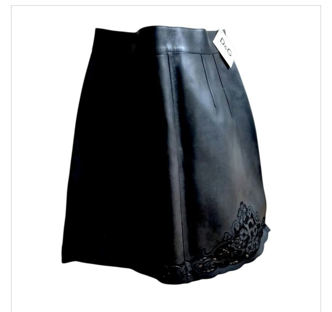 Dolce & Gabbana Leather Skirt (Category: Skirts) located in Paranaque City. Submitted by calm_youngstore7 (Listing ID 1469584241, Image 2). Description: ON SALE ! 70% OFF RETAIL! - Brand: Dolce & Gabbana - Material: Premium black leather - Origin: Made in Italy - Details: Beautiful black l bottom cut out hem - Fit: High-waisted with subtle pleats near the waistband - Condition: Brandnew with tag attached, excellent luxury piece.