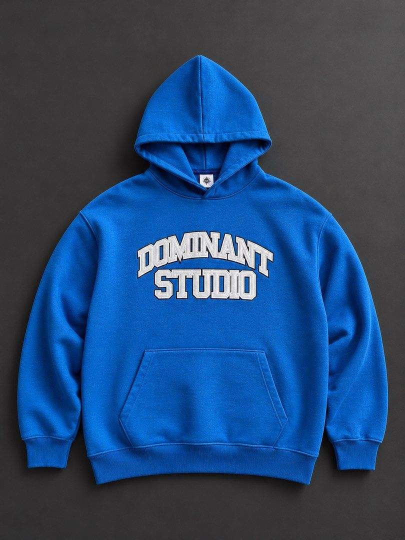 Dominant Studio Blue College Hoodie (Category: Coats, Jackets and Outerwear) located in Manila. Submitted by seth_inting. (Listing ID 1469724613, Image 1). Description: - Brand: Dominant Studio - Color: Bright blue - Design: Large white embroidered collegiate lettering on chest - Features: Drawstring hood, front kangaroo pocket, ribbed cuffs and hem - Condition: Excellent, clean fabric with zero fading or wear - Style: Solid streetwear staple.