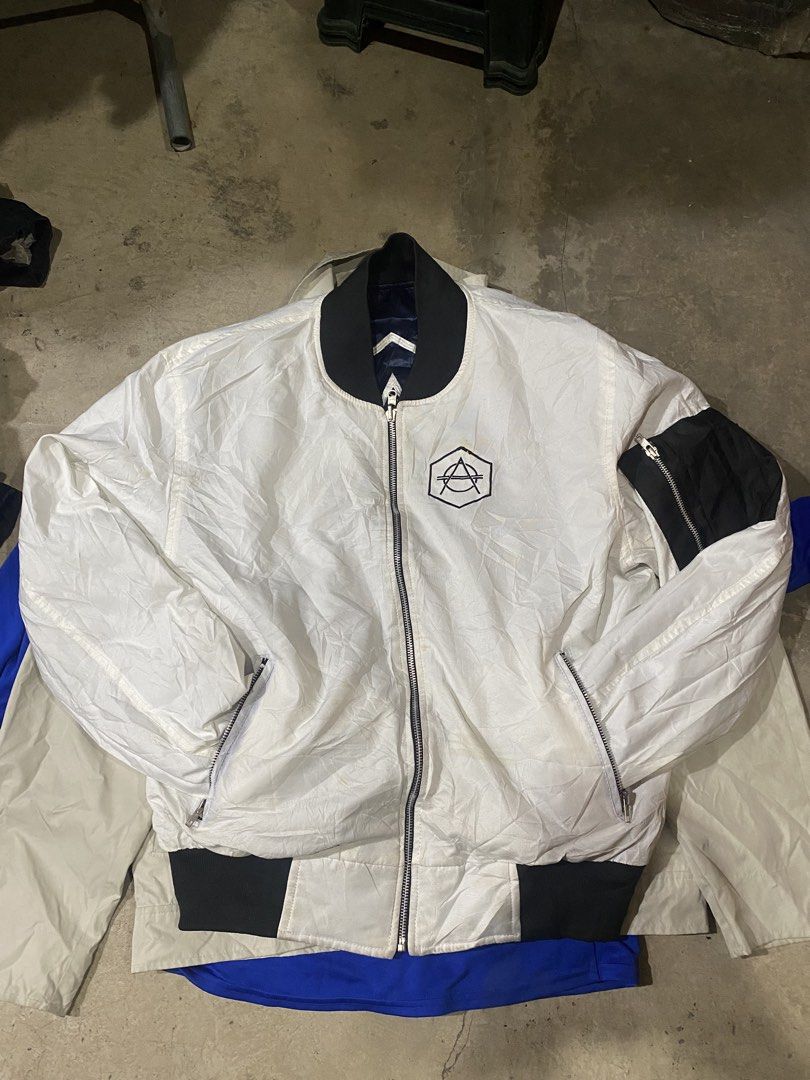 Don Diablo Reversible Bomber Jacket White Blue (Category: Coats, Jackets and Outerwear) located in Manila. Submitted by vastfalcon.f312db (Listing ID 1469721629, Image 1). Description: - Authentic Don Diablo reversible bomber jacket - Side 1: Solid white with black collar/cuffs, back logo, and rare hand-signed autographs - Side 2: Shiny navy blue with matching back logo - Features full-zip front, sleeve utility pocket, and side pockets - Conditio