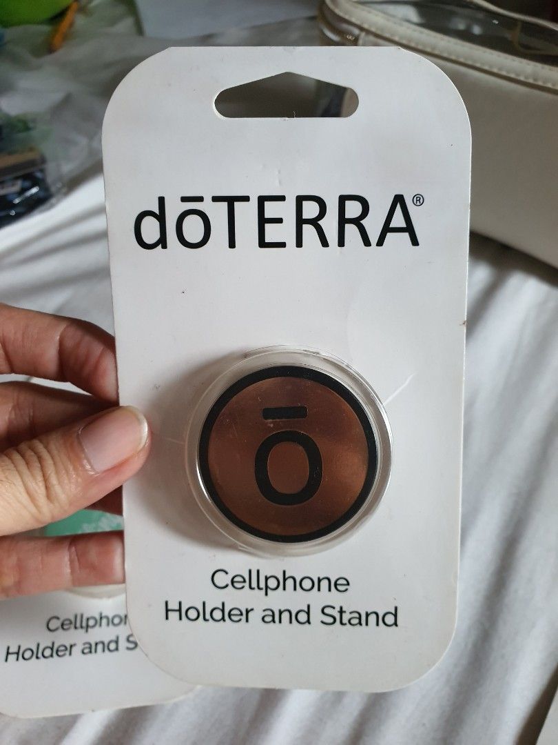 Doterra Cellphone holder/stand (Category: Everything Else Others) located in Paranaque City. Submitted by nicessities (Listing ID 1469638109, Image 3). Description: dōTERRA Cellphone Holder/Stand collectible Php 250 each purchased personally from US during doterra convention brand new, never used excess.
