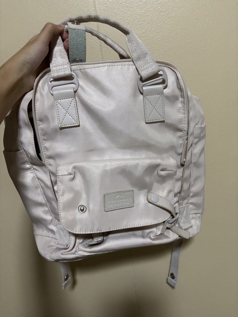 Doughnut backpack in ivory (Category: Backpacks) located in Quezon City. Submitted by goldbrews (Listing ID 1469666507, Image 1). Description: Doughnut classic backpack - classic doughnut backpack design - fits 14” MacBook -has padded laptop sleeve inside - many pockets for organization .