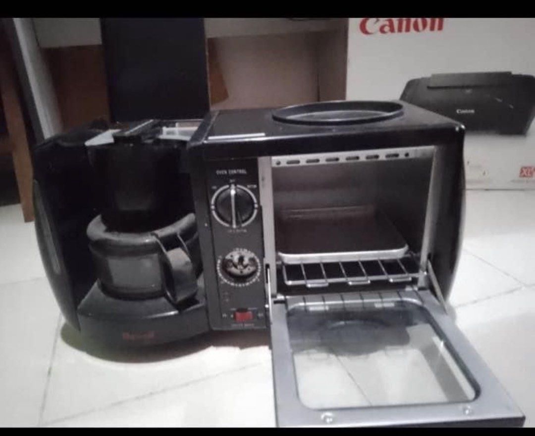 Dowell 3-in-1 Coffee Maker Toaster Oven Black (Category: Ovens & Toasters) located in Manila. Submitted by eacosta16227721 (Listing ID 1469620163, Image 3). Description: - Brand/Model: Dowell Multi-function Breakfast Station (Black) - Features: Coffee maker, toaster oven, and top warming surface all in one - Condition: Working fine, well-maintained - Space Saver: Compact design ideal for small kitchens, dorm rooms, or condos - Included Accessorie