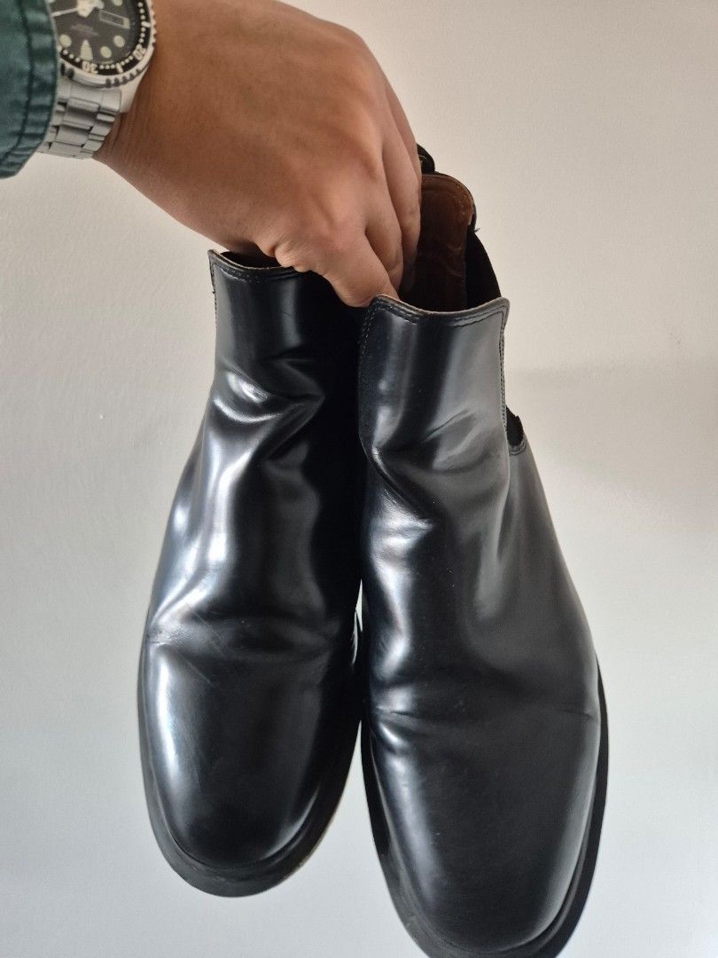 Dr. Martens Black Chelsea Boots (Category: Boots) located in Makati City. Submitted by tapsj (Listing ID 1469702321, Image 2). Description: - Brand: Dr. Martens - Style: Black leather Chelsea boots - Fit: Elastic side panels for easy slip-on - Details: Classic pull loops with iconic yellow stitching - Soles: Signature bouncing rubber soles with solid tread - Condition: Normal leather creasing from wear; soles have minor dirt.