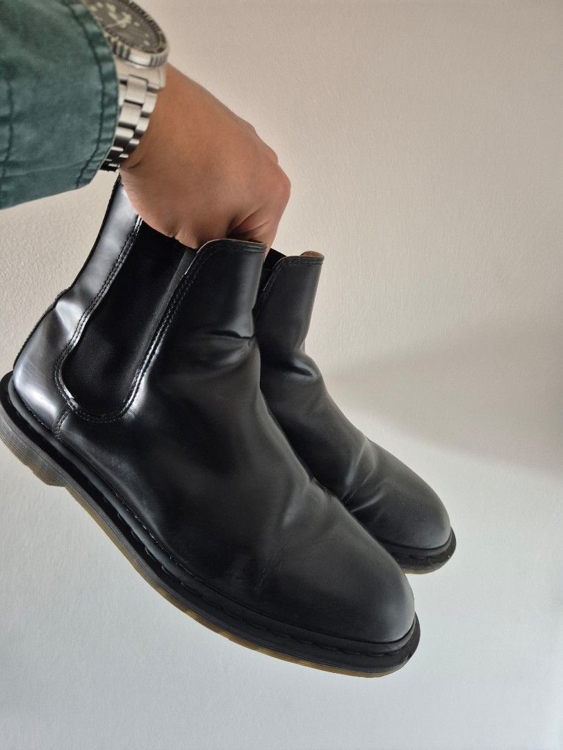 Dr. Martens Black Chelsea Boots (Category: Boots) located in Makati City. Submitted by tapsj (Listing ID 1469702321, Image 1). Description: - Brand: Dr. Martens - Style: Black leather Chelsea boots - Fit: Elastic side panels for easy slip-on - Details: Classic pull loops with iconic yellow stitching - Soles: Signature bouncing rubber soles with solid tread - Condition: Normal leather creasing from wear; soles have minor dirt.