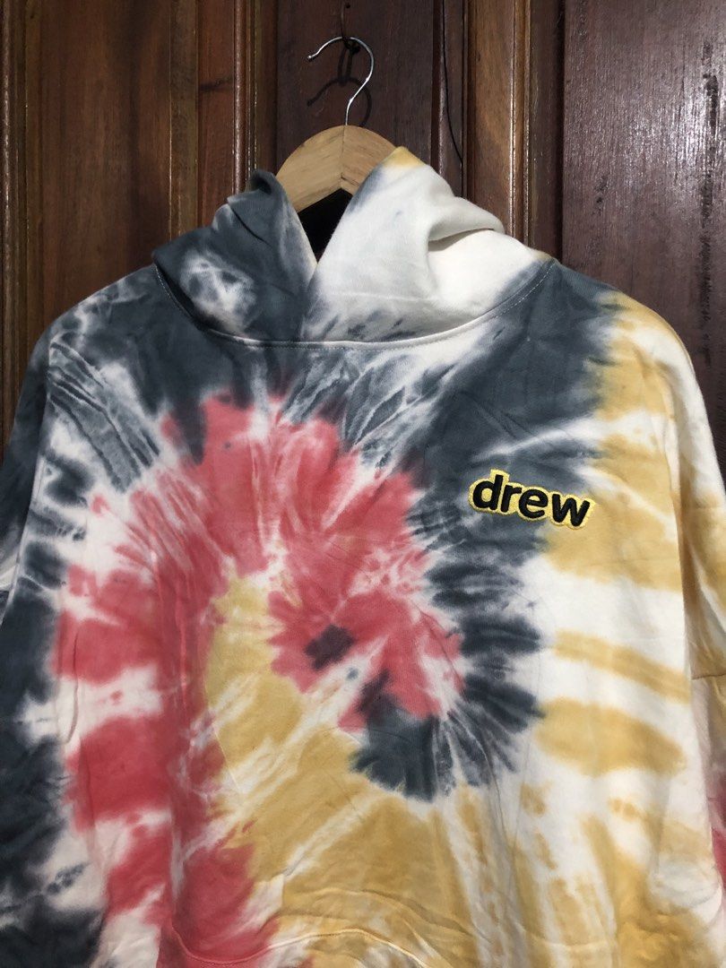 drew house tie dye hoodie (Category: Hoodies) located in Quezon City. Submitted by yeahsource222 (Listing ID 1469745100, Image 2). Description: - Brand: Drew House - Size: XL - Color: Multicolor spiral (black, white, red, yellow) - Material: 100% cotton, heavy fleece (Made in USA) - Details: Embroidered chest logo, front kangaroo pocket - Style: Streetwear, very comfortable.