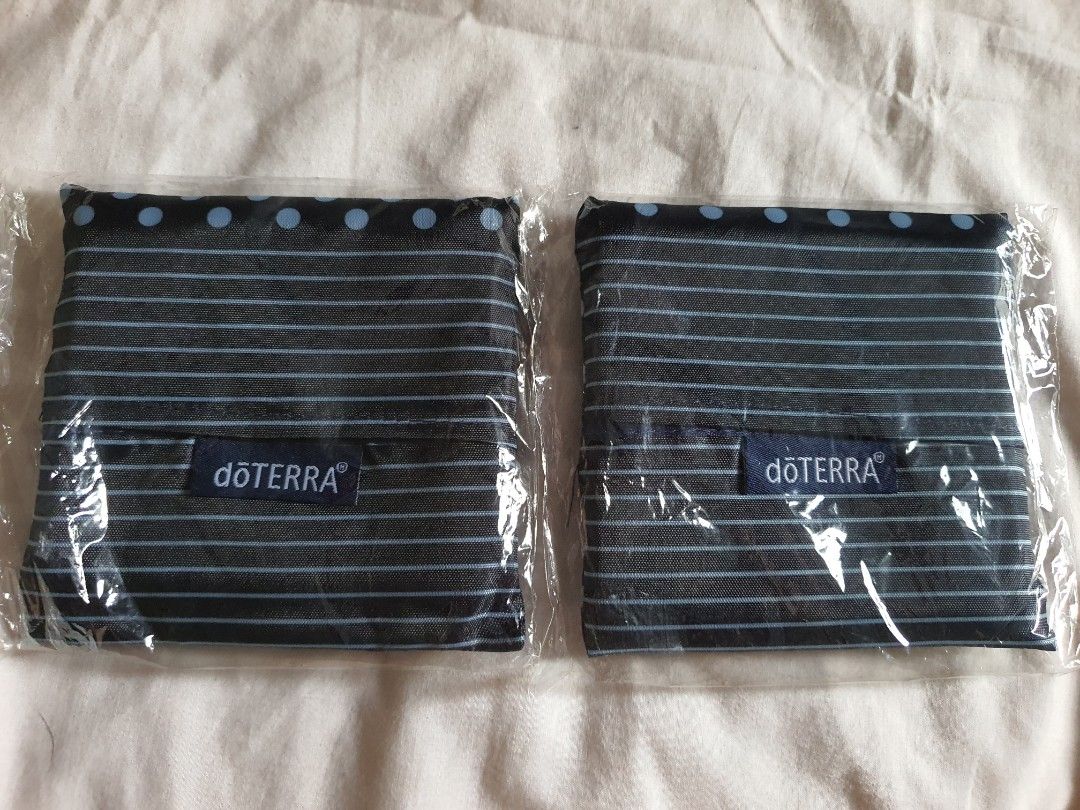 dōTERRA US Foldable Shopping Tote (Category: Tote Bags) located in Paranaque City. Submitted by nicessities (Listing ID 1469642624, Image 2). Description: - dōTERRA foldable shopping totes - Brand new in original plastic packaging - Stylish navy blue with light blue polka dots and stripes - Compact and lightweight design that folds up small - Perfect for groceries, shopping, and everyday carry purchased personally from US doTERRA convention RFS: 