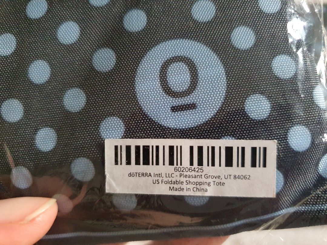 dōTERRA US Foldable Shopping Tote (Category: Tote Bags) located in Paranaque City. Submitted by nicessities (Listing ID 1469642624, Image 3). Description: - dōTERRA foldable shopping totes - Brand new in original plastic packaging - Stylish navy blue with light blue polka dots and stripes - Compact and lightweight design that folds up small - Perfect for groceries, shopping, and everyday carry purchased personally from US doTERRA convention RFS: 