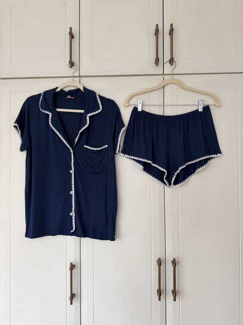 Eberjey Navy Blue Short Sleeve Pajama Set (Category: Sets or Coordinates) located in Makati City. Submitted by belizalde4 (Listing ID 1469657942, Image 2). Description: - Color: Navy blue with white scalloped stitching - Set includes: Short sleeve button-up top with chest pocket and matching shorts - Material: Super soft and comfortable fabric - Ideal for: Sleeping or lounging at home.