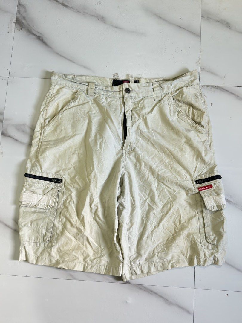 Ecko Unltd Beige Cargo Shorts with Zipper Pockets (Category: Shorts) located in Cavite. Submitted by remcadzzz (Listing ID 1469609694, Image 1). Description: - Brand: Ecko Unltd - Color: Classic beige - Material: Sturdy, durable cotton fabric - Pockets: Multiple utility pockets with secure zipper closures and red logo tag - Details: Signature rhino embroidery on the back pocket, waistband with belt loops - Style: Streetwear staple, versatile and 