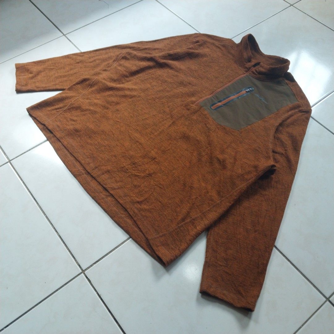 Eddie Bauer Brown Fleece 1/2 Zip Pullover (Category: Coats, Jackets and Outerwear) located in Cavite. Submitted by spinfits (Listing ID 1469710705, Image 2). Description: - Brand: Eddie Bauer - Style: 1/2 zip fleece pullover - Size: Men's XXL - Color: Warm brown heather with contrast olive green zippered chest pocket - Material: Soft polyester shell with durable nylon-spandex pocket - Care: Machine washable (warm), tumble dry low - Condition: Gre