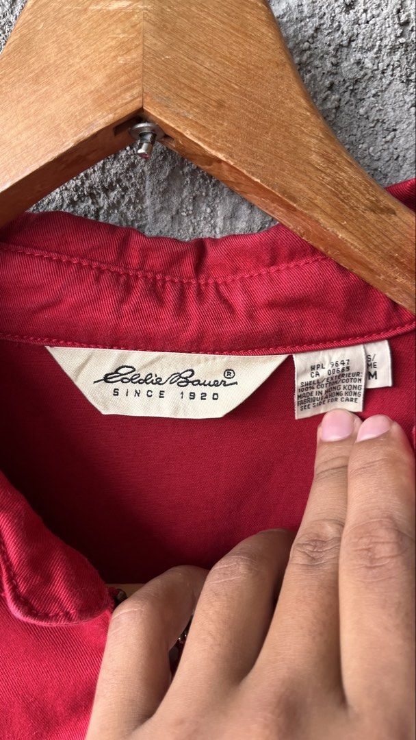 Eddie Bauer Red Cotton Zip-Up Jacket (Category: Coats, Jackets and Outerwear) located in Cabuyao City. Submitted by bulandos (Listing ID 1469581410, Image 2). Description: - Brand: Eddie Bauer - Size: Men's Medium - Color: Bright red with blue and green tartan plaid lining - Material: 100% Cotton - Features: Full zip front, front pockets, elastic cuffs and hem, classic collar with hidden plaid detail - Origin: Made in Hong Kong - Condition: Excel