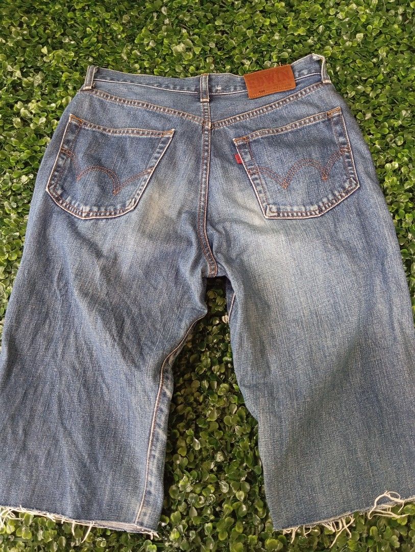 Edwin 503 Denim Jorts Cutoff Shorts (Category: Shorts) located in Sariaya. Submitted by angelochintes732 (Listing ID 1469593399, Image 1). Description: - Brand/Model: Edwin 503 Denim Shorts - Wash/Style: Classic blue wash, cutoff style with raw frayed hems - Details: Iconic leather waist patch, contrast orange stitching - Size: Tagged size 31 x 33 - Measurements: Roughly 16 inches across waist, 24 inches total length - Condition: Great everyday c