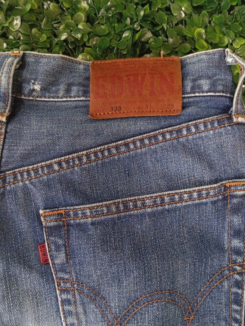Edwin 503 Denim Jorts Cutoff Shorts (Category: Shorts) located in Sariaya. Submitted by angelochintes732 (Listing ID 1469593399, Image 2). Description: - Brand/Model: Edwin 503 Denim Shorts - Wash/Style: Classic blue wash, cutoff style with raw frayed hems - Details: Iconic leather waist patch, contrast orange stitching - Size: Tagged size 31 x 33 - Measurements: Roughly 16 inches across waist, 24 inches total length - Condition: Great everyday c