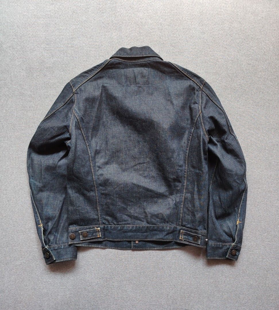 EDWIN E-Functional Denim Trucker Jacket (E2201-00) (Category: Coats, Jackets and Outerwear) located in Taguig. Submitted by _theroom.ph (Listing ID 1469636592, Image 2). Description: - Brand: Function Edwin - Style: Classic denim trucker jacket - Color: Clean dark wash indigo - Details: Front button closures, buttoned chest pockets with signature red tab - Accents: Contrasting stitching, branded metal buttons, and brown leather neck patch - Condi