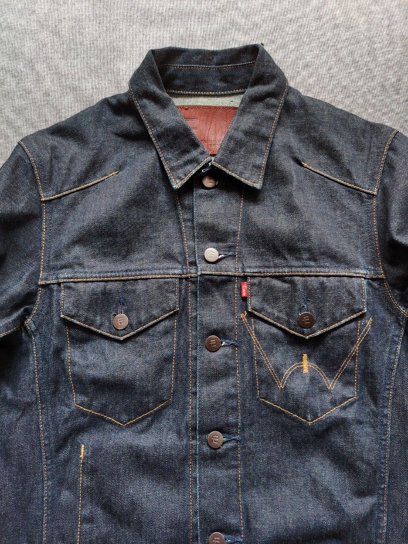 EDWIN E-Functional Denim Trucker Jacket (E2201-00) (Category: Coats, Jackets and Outerwear) located in Taguig. Submitted by _theroom.ph (Listing ID 1469636592, Image 3). Description: - Brand: Function Edwin - Style: Classic denim trucker jacket - Color: Clean dark wash indigo - Details: Front button closures, buttoned chest pockets with signature red tab - Accents: Contrasting stitching, branded metal buttons, and brown leather neck patch - Condi
