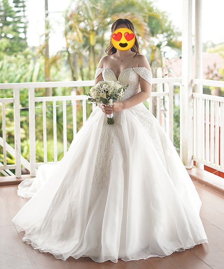 Embroidered with Beads Wedding Gown Long Train (Category: Evening dresses & gowns) located in Manila. Submitted by lndsyjycbe98167 (Listing ID 1469603588, Image 2). Description: Last price 13k ‼️ 26k orig price WEDDING GOWN FOR SALE 👰🏻‍♀️💍 Selling my customized beautiful wedding gown. RFS: No storage * Size ( Bust: 34 1/2 | Waist: 28) * Embroidered with beads * Zipper at the back * Detachable off-shoulder sleeves for reception look * Pocket bo
