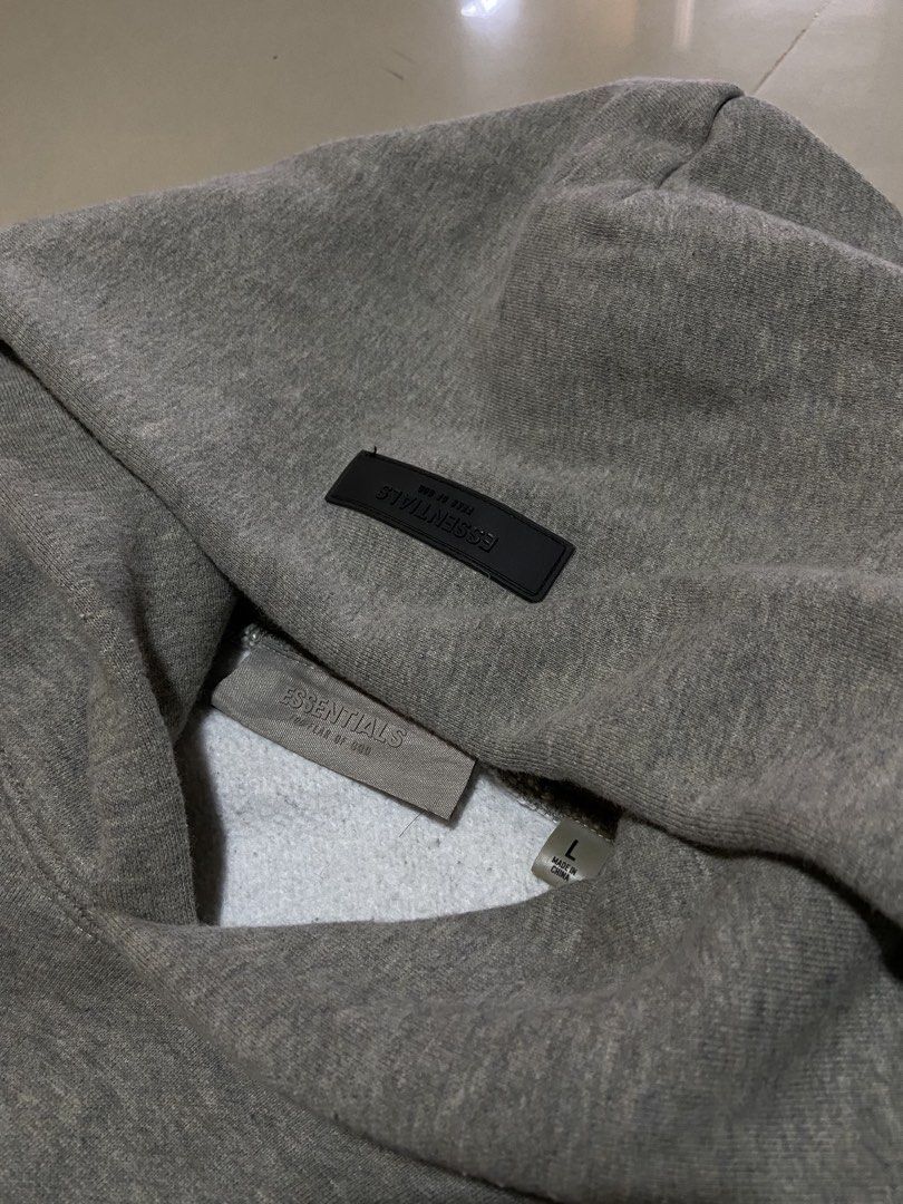 ESSENTIALS FEAR OF GOD (Category: Coats, Jackets and Outerwear) located in San Pablo. Submitted by tripnthrift15 (Listing ID 1469640830, Image 2). Description: ESSENTIAL FEAR OF GOD HOODIE SIZE LARGE ON TAG COMPLETE TAGS GOOD CONDITION DIMES 26*26.