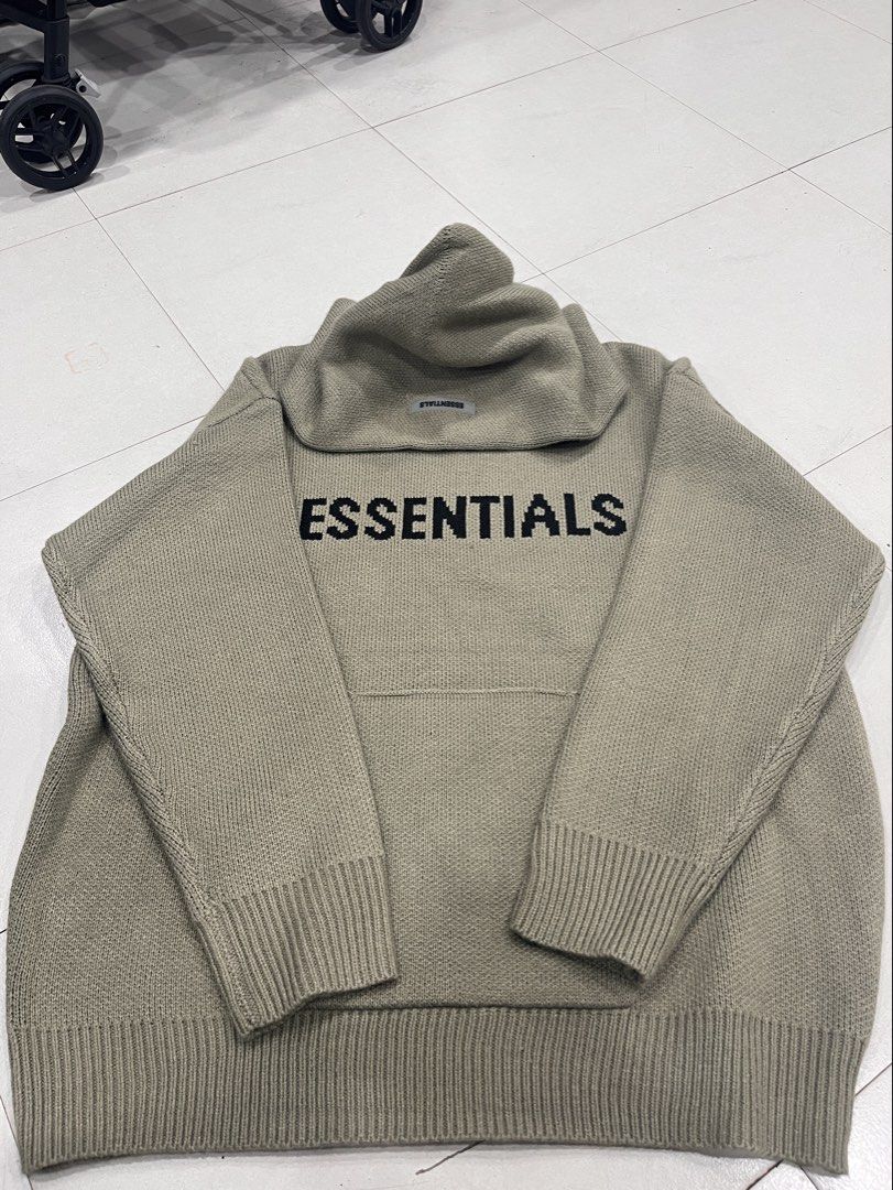 ESSENTIALS Knit Hoodie (Category: Coats, Jackets and Outerwear) located in Manila. Submitted by style_hoods (Listing ID 1469618273, Image 1). Description: Color: Heather Olive / Taupe — warm neutral tone • Material: Soft, thick knit fabric — feels luxurious and cozy • Design: Bold “ESSENTIALS” lettering knitted into the chest (not printed!) • Fit: Signature oversized, drop-shoulder, boxy fit — intentionally long sleeves and relaxed cut • Features