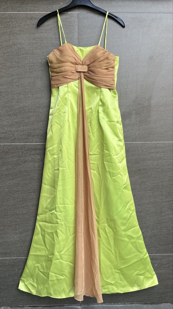 Evening gown (Category: Evening dresses & gowns) located in Cainta. Submitted by klejre (Listing ID 1469688422, Image 1). Description: Floor-length satin formal gown in a bright lime-green or chartreuse shade, featuring thin spaghetti straps and a draped tan or champagne-colored bodice overlay with a center bow and cascading sash. .