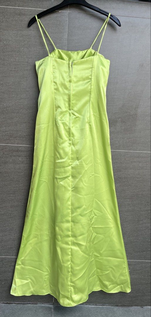 Evening gown (Category: Evening dresses & gowns) located in Cainta. Submitted by klejre (Listing ID 1469688422, Image 2). Description: Floor-length satin formal gown in a bright lime-green or chartreuse shade, featuring thin spaghetti straps and a draped tan or champagne-colored bodice overlay with a center bow and cascading sash. .