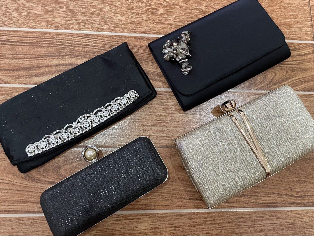 Evening Party Clutch Bags (Category: Clutches) located in Mandaue City. Submitted by piacatrina08 (Listing ID 1469662495, Image 2). Description: P 90 per piece or take all 4pcs for 300! - Clutch 1: Black satin with rhinestones along the flap edge - Clutch 2: Black satin featuring a stunning floral crystal cluster - Clutch 3: Black glitter hard case with a chic pearl clasp - Clutch 4: Champagne gold textured hard case with a metallic V-closure .