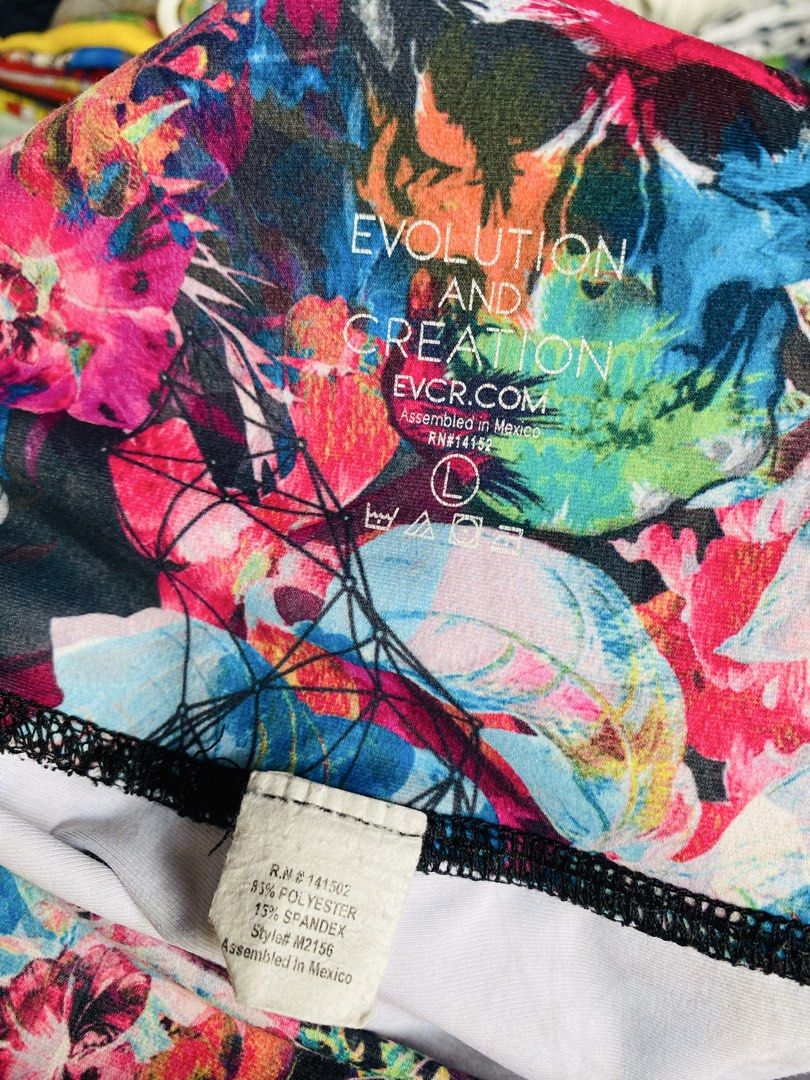 Evolution and Creation Skull Floral Leggings (Category: Activewear) located in Caloocan City. Submitted by lovemyclothes21 (Listing ID 1469611386, Image 3). Description: - Brand/Model: Evolution and Creation Leggings - Design: Eye-catching colorful skull and floral graphic pattern - Size: L (Waist: 30 to 32 inches, Length: 35 inches) - Material: 85% polyester, 15% spandex (soft and stretchy) - Versatility: Perfect for workouts, yoga, or casual ev