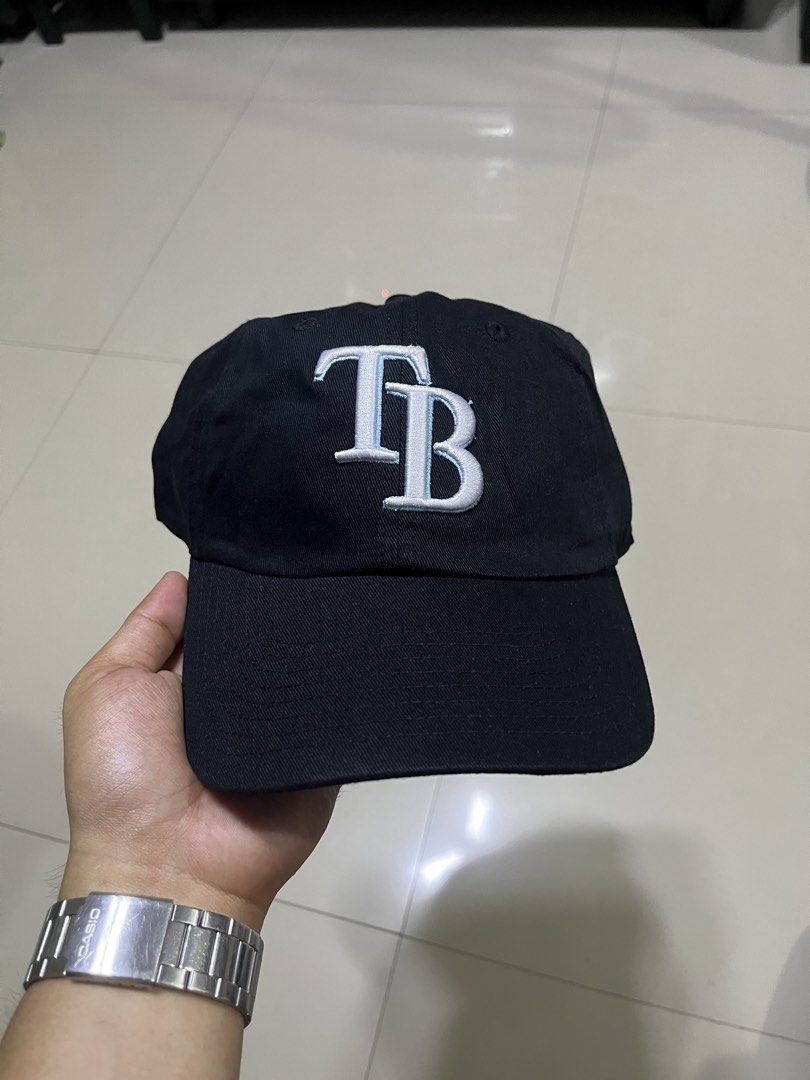 Fan Favorite Black TB Baseball Cap One Size (Category: Caps & Hats) located in Quezon City. Submitted by flip_da_cash (Listing ID 1469648349, Image 1). Description: - Brand: Fan Favorite - Color: Classic Black with light blue and white embroidered TB logo - Material: 100% Cotton (Made in Bangladesh) - Fit: One size fits all with an adjustable strapback and brass buckle - Condition: Brand new / Excellent - Perfect for daily casual streetwear and s