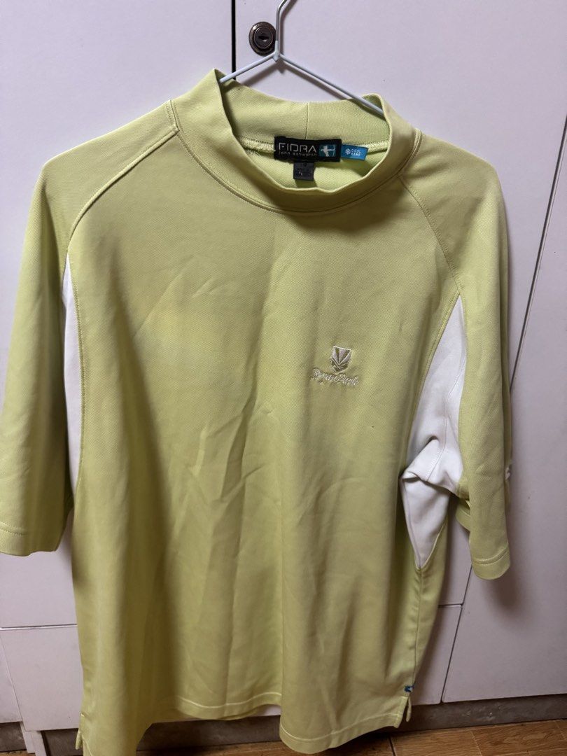 Fidra Bryan Park Golf Shirt (Category: Tshirts & Polo Shirts ) located in Manila. Submitted by quintessesommerset (Listing ID 1469686026, Image 1). Description: - Brand: Fidra John Ashworth 23x28 - Color: Lime green with white side panels - Size: L - Features: Mock neck, short sleeves, embroidered Bryan Park chest logo - Tech: Cool Hand fabric technology keeps you dry and comfortable - Condition: Clean, well-kept, and ready to wear.