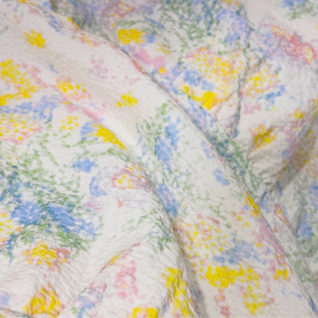 Floral spaghetti strap tiered midi dress (Category: Dresses) located in General Trias. Submitted by dearsunnyshine (Listing ID 1469725942, Image 2). Description: - Style: White midi dress with colorful floral print (yellow, blue, and pink) - Design: Spaghetti straps, square neckline, and tiered skirt - Fabric: Textured material, lightweight and great for warm weather - Versatility: Perfect for casual outings and weekend brunches - Pairing: Easy t