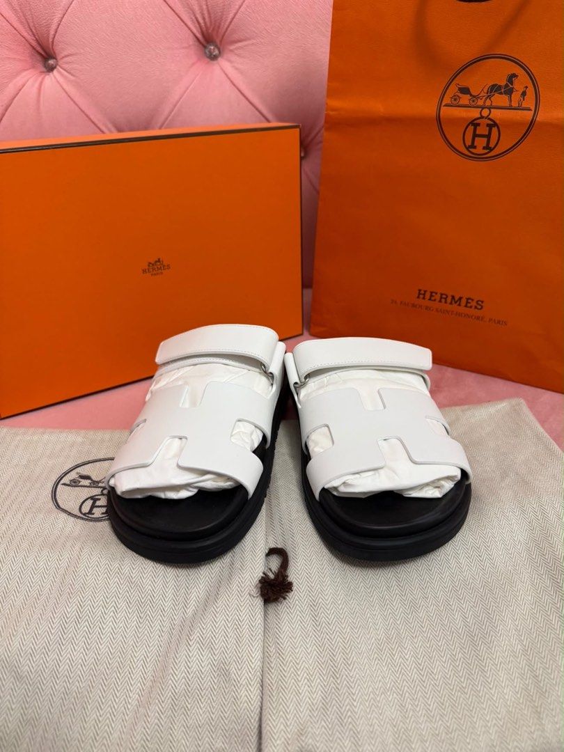For Sale (Category: Sneakers & Footwear) located in Makati City. Submitted by juliettt23 (Listing ID 1469612934, Image 2). Description: Authentic Hermès Chypre Sandals in White 🌺 Size 38 ( but runs small Will Fit To Size 37 or 37.5 feet ) 🌺 Unused / Just Fit 🌺 comes with paperbag, Dustbags and Box 🌺 Selling This for Only 58K 🥹🥹🥹.