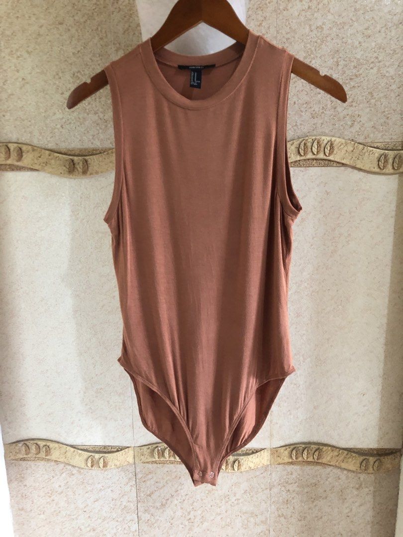 FOREVER 21 bodysuit (Category: Others Tops) located in Santa Rosa. Submitted by eceldg05 (Listing ID 1469606767, Image 1). Description: F21 bodysuit Cotton flowy fabric Med/large Excellent.