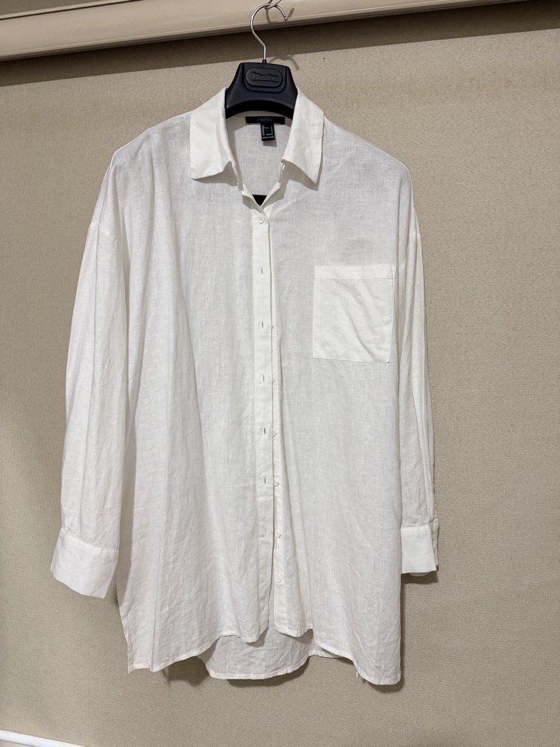 Forever 21 White Button-Down Shirt Size S (Category: Shirts) located in Cavite. Submitted by mgd.blessed (Listing ID 1469632642, Image 1). Description: - Brand: Forever 21 - Size: S (Oversized fit) - Color: White - Details: Classic collar, front chest pocket, button-up front, long sleeves - Fabric: Lightweight with a slight texture - Style: Clean minimalist staple, easy to layer or wear solo - Condition: Excellent.