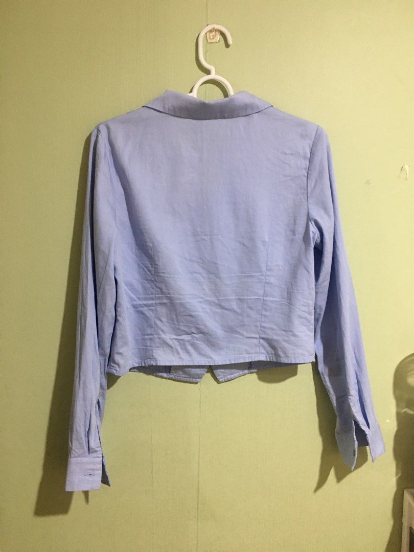 Formal Cropped Longsleeve Blouse (Category: Blouses) located in Cabuyao City. Submitted by 4everblooms (Listing ID 1469749519, Image 3). Description: - Color: Light blue - Size: Small - Med - Material: Standard cotton blend, standard fit - Condition: Good, but has a small stain near the bottom left front hem (kindly check the last photo).