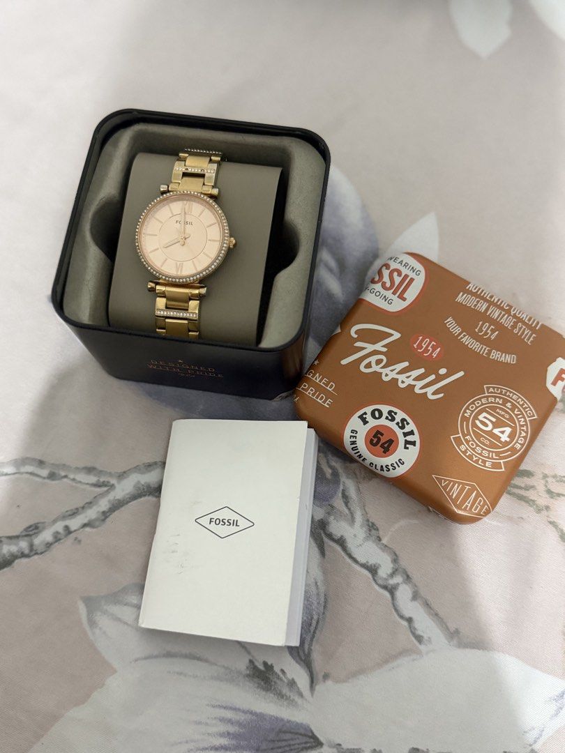 Fossil Gold-Tone Watch with Crystal Bezel (Category: Women's Watches) located in Manila. Submitted by maambeeeeyah (Listing ID 1469678345, Image 3). Description: - Brand: Fossil - Color: Gold-tone with a stunning rose gold dial - Details: Sparkling crystal stones on the bezel and bracelet links, classic analog display with Roman numerals at 12 and 6 - Condition/Inclusions: Comes with original tin box, manual, and price tag - Style: Versatile acce