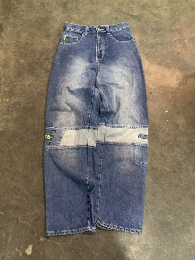 Fox Sportswear Denim Jeans (Category: Jeans) located in Cagayan de Oro. Submitted by agboysalis60090 (Listing ID 1469743040, Image 1). Description: Fox Sportswear denim jeans in medium blue wash. Features contrast stitching, neon green accents, and cargo pocket details on the legs. Branded buttons and embroidered fox logos on back pockets. Loose fit straight leg style. Tagged brand label inside waistband..