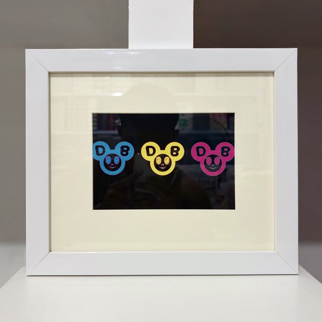 Framed Takashi Murakami Postcard “POP - DOB” (Category: Art & Prints) located in Santa Rosa. Submitted by shikaricollectibles (Listing ID 1469625806, Image 1). Description: Framed Takashi Murakami Postcard “POP - DOB” An art postcard featuring Takashi Murakami, released in 2001. Postcard Size: 6.9 x 4.75 inches Frame Size: 12.3 x 10.1 inches Frame Thickness: 1 inches Frame Color: White Glazing: Glass Mat Border: 2 Inches Mat Color: Off-white.