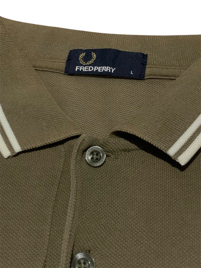 Fred (Category: Tshirts & Polo Shirts ) located in Manila. Submitted by lyf_7hrift (Listing ID 1469673634, Image 3). Description: Fred Perry Polo P850 28L 20.5W Dimes 9/10 Color Rate Excellent Condition.