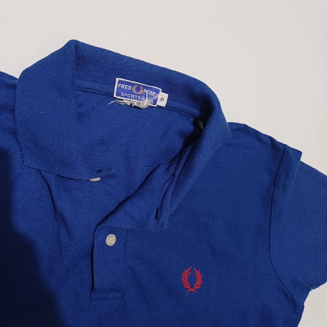 Fred Perry Blue Polo Shirt (Category: Tshirts & Polo Shirts ) located in Pasig City. Submitted by padillaaub64242 (Listing ID 1469653206, Image 2). Description: - Brand: Fred Perry - Size Small on tag fit to Medium -19×25 Inches.