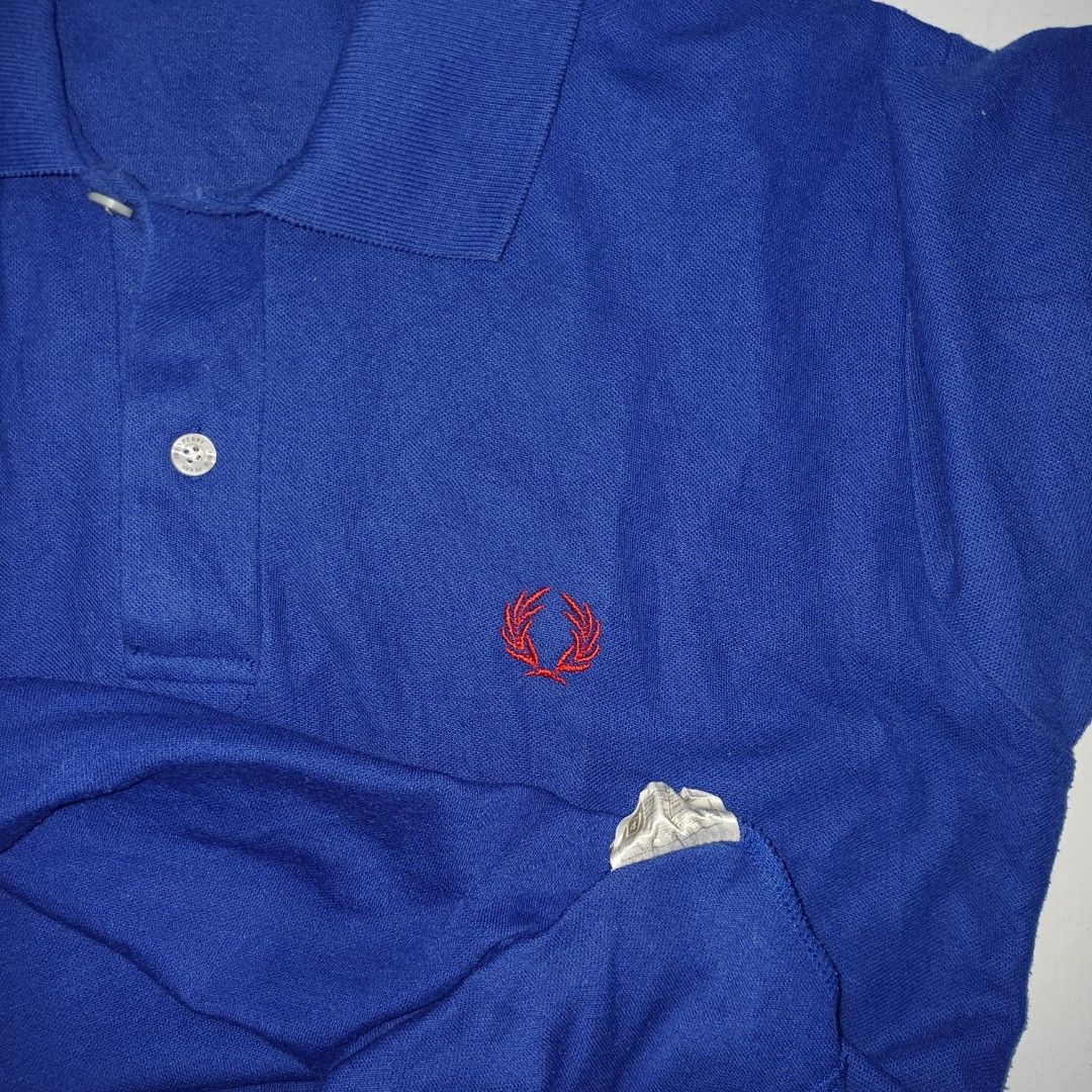 Fred Perry Blue Polo Shirt (Category: Tshirts & Polo Shirts ) located in Pasig City. Submitted by padillaaub64242 (Listing ID 1469653206, Image 3). Description: - Brand: Fred Perry - Size Small on tag fit to Medium -19×25 Inches.