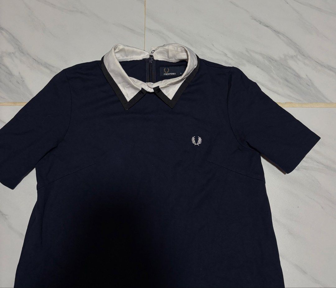 Fred Perry Navy Polo Dress (Category: Dresses) located in Baguio. Submitted by thriftedbaguio (Listing ID 1469620146, Image 2). Description: Excellent Condition Size 10 Tagged Dimensions 18*36 Color rate 10 .