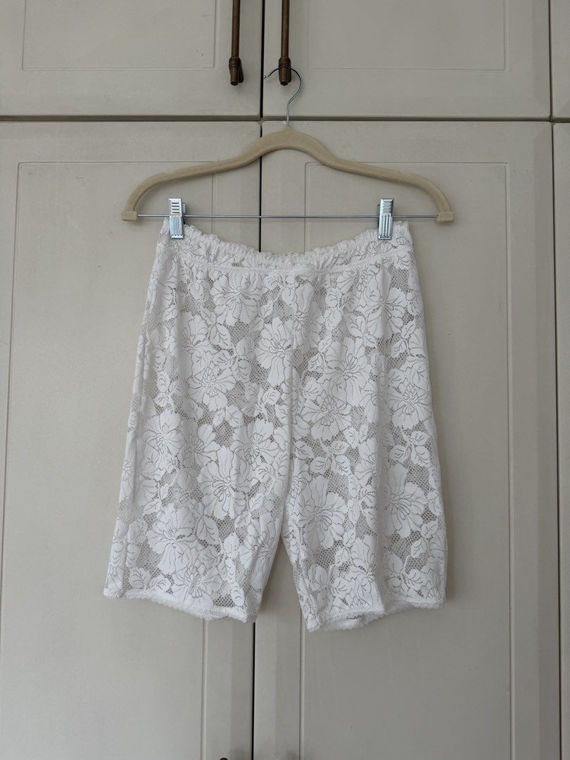 Free People White Lace Shorts (Category: Shorts) located in Makati City. Submitted by belizalde4 (Listing ID 1469657201, Image 2). Description: - Brand: Intimately Free People - Size: M - Color: White - Material: Delicate sheer floral lace with stretchy elastic waistband - Style: Biker shorts, great for layering under oversized shirts or dresses.